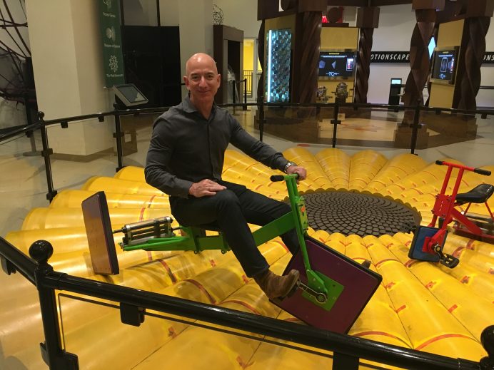 Jeff Bezos riding a bike with square wheels