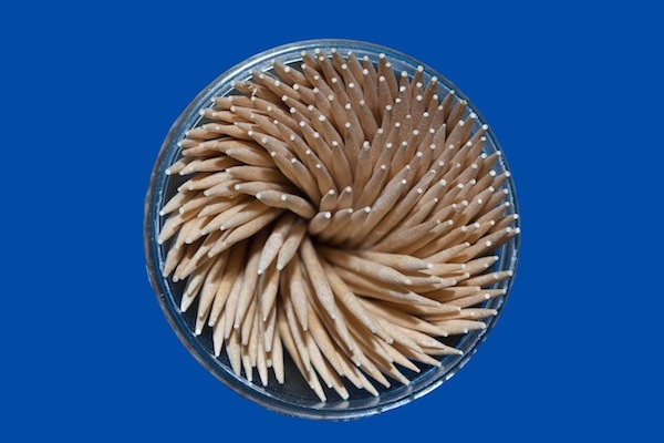 Overhead view of toothpicks in round container