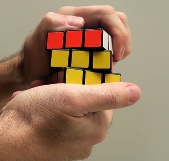 Hands solving Rubik's cube