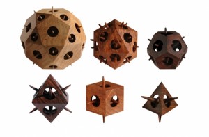a large icosidodecahedron and the five Platonic solids: icosahedron, dodecahedron, octahedron, cube, and tetrahedron